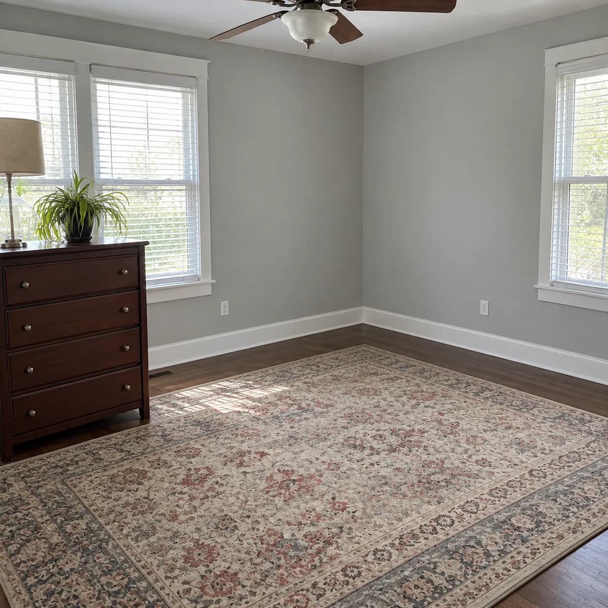 The same Fort Worth bedroom cleared back to the rug and a single dresser after the cleanout